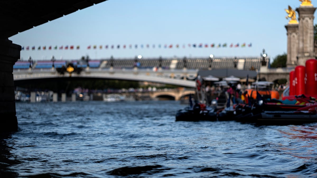 (AP Photo/David Goldman) : The Seine River flows in front of the Pont Alexandre III bridge, site of the triathlon events at the 2024 Summer Olympics, Monday, July 29, 2024, in Paris. As the Olympics continue in Paris, the Seine River's water quality remains a major area of concern for officials. Organizers of the triathlon event cancelled swimming practice on Monday for the second day in a row because of poor water quality. Event organizers hope sunny weather will make swimming viable on Tuesday when the triathlon begins. 

